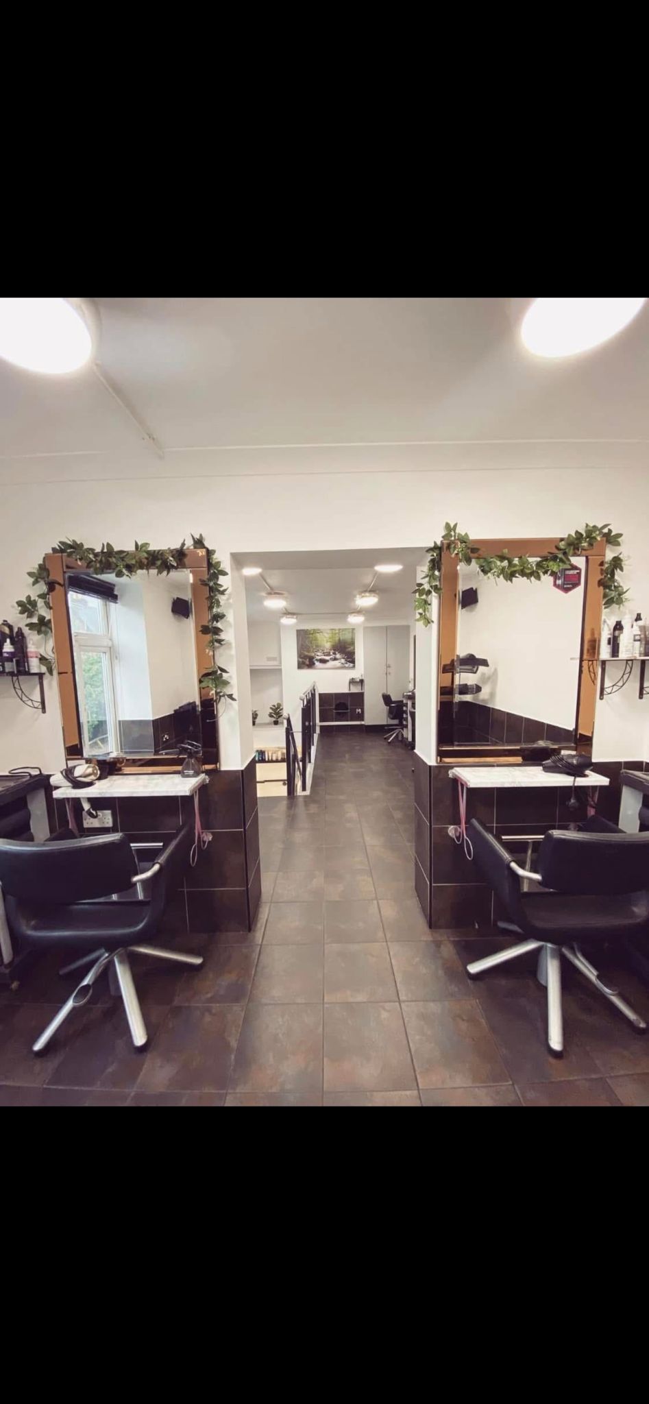 Salon 64 interior showing professional styling stations in Dereham town centre